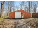 Outdoor building with a large metal door and brown trim at 1828 W 750 S, Trafalgar, IN 46181