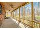 Spacious screened porch with natural light and views of the surrounding trees at 1828 W 750 S, Trafalgar, IN 46181