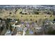 An aerial view showcases a neighborhood bordering the golf course and mature trees at 2109 Elmwood Dr, Lebanon, IN 46052