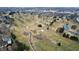 Aerial view of a well-manicured golf course with meandering creeks, picturesque ponds, and lush greenery at 2109 Elmwood Dr, Lebanon, IN 46052