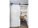 Bathroom featuring sliding door, stylish vanity, and herringbone floors at 2109 Elmwood Dr, Lebanon, IN 46052