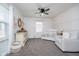 Well-lit Bedroom featuring a white crib and plush seating at 2109 Elmwood Dr, Lebanon, IN 46052