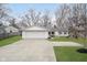 Charming home with a spacious driveway and well-manicured lawn at 2109 Elmwood Dr, Lebanon, IN 46052