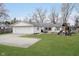 Charming single-story home with a well-maintained lawn, attached garage, and a fun play structure in the backyard at 2109 Elmwood Dr, Lebanon, IN 46052