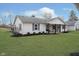 Charming home featuring well-manicured lawn and welcoming front porch with swing, perfect for relaxing outdoors at 2109 Elmwood Dr, Lebanon, IN 46052
