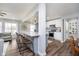 Open concept kitchen with a large island, stainless steel appliances, and modern lighting fixtures at 2109 Elmwood Dr, Lebanon, IN 46052