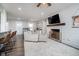 Cozy living room with a fireplace, shiplap accent wall, and comfortable seating at 2109 Elmwood Dr, Lebanon, IN 46052