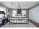 Bedroom featuring a comfortable bed, modern lighting, and exercise equipment at 2109 Elmwood Dr, Lebanon, IN 46052