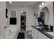 Bright bathroom featuring a soaking tub, walk-in closet, and modern fixtures at 2180 Quarter Path Rd, Cicero, IN 46034