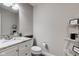 A half-bathroom with a granite sink and modern decor at 2180 Quarter Path Rd, Cicero, IN 46034