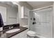 This bathroom has a granite countertop, shower with glass doors, and ample storage at 2180 Quarter Path Rd, Cicero, IN 46034