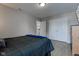 This bedroom has a large closet, a comfortable bed, and light gray walls at 2180 Quarter Path Rd, Cicero, IN 46034