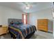 Comfortable bedroom with a full bed and side tables with drawers for storage at 2180 Quarter Path Rd, Cicero, IN 46034