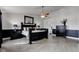Large main bedroom with a black wood bedroom set and plenty of natural light at 2180 Quarter Path Rd, Cicero, IN 46034