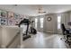 An exercise room with a treadmill, elliptical, windows, and hardwood floors at 2180 Quarter Path Rd, Cicero, IN 46034