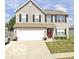 Charming two-story home with neutral siding, black shutters, and a well-manicured lawn at 2180 Quarter Path Rd, Cicero, IN 46034