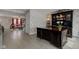 Well-lit office space with a large desk, custom shelving, and neutral decor at 2180 Quarter Path Rd, Cicero, IN 46034