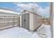 This backyard has a storage shed with double doors and a neutral color scheme at 2180 Quarter Path Rd, Cicero, IN 46034