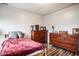 This bedroom has a cozy feel, complete with wood floors, natural light and two wood dressers at 2357 Central Ave, Indianapolis, IN 46205