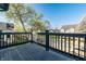 Deck with black railing offers views of the surrounding neighborhood and street at 2357 Central Ave, Indianapolis, IN 46205