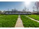 Well-maintained building with a lush green lawn and inviting walkway leading to the entrance at 2357 Central Ave, Indianapolis, IN 46205