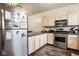 The kitchen has stainless steel appliances, light wood cabinets, and a dark countertop at 2357 Central Ave, Indianapolis, IN 46205