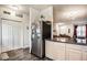 An updated kitchen has stainless steel appliances, light wood cabinets, and hard surface flooring at 2357 Central Ave, Indianapolis, IN 46205