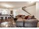 Open-concept living room boasts modern flooring, neutral colors, and a staircase at 2357 Central Ave, Indianapolis, IN 46205