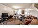 Comfortable living room with TV, decorative storage, and modern open layout to the kitchen at 2357 Central Ave, Indianapolis, IN 46205