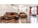 Bright living room showcases stylish furniture, a staircase, and a view to the outside at 2357 Central Ave, Indianapolis, IN 46205