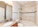 Stylish bathroom with granite countertop, tiled shower over tub and neutral color scheme at 2564 Tangleridge Ln, Brownsburg, IN 46112