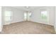 Spacious bedroom with plush carpeting, three windows, and soft, natural light at 2564 Tangleridge Ln, Brownsburg, IN 46112