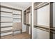 Organized walk-in closet with custom shelving and drawers for optimal storage at 2564 Tangleridge Ln, Brownsburg, IN 46112