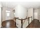 Bright foyer showcasing dark hardwood floors and white trim with a staircase at 2564 Tangleridge Ln, Brownsburg, IN 46112