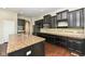 Gourmet kitchen features a large island, stainless steel appliances, and beautiful wood floors at 2564 Tangleridge Ln, Brownsburg, IN 46112