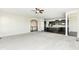 Bright living room with ceiling fan adjacent to the gourmet kitchen with dark wood cabinets at 2564 Tangleridge Ln, Brownsburg, IN 46112
