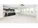 Open-concept living room boasts lots of natural light and seamlessly flows into the adjacent kitchen at 2564 Tangleridge Ln, Brownsburg, IN 46112