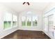 Bright sun room with lots of windows, hardwood floors, and access to the backyard at 2564 Tangleridge Ln, Brownsburg, IN 46112