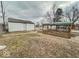 Backyard showcasing a shed and sheltered patio space, ideal for outdoor activities at 3049 Foltz St, Indianapolis, IN 46241