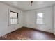 Cozy bedroom with hardwood floors and natural light from two windows at 3049 Foltz St, Indianapolis, IN 46241