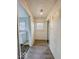 Hallway featuring laminate floors and natural light from a window at 3049 Foltz St, Indianapolis, IN 46241