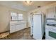 A kitchen features a large sink, tiled floors, a refrigerator and gas stove/oven combo at 3049 Foltz St, Indianapolis, IN 46241