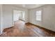 Spacious living room featuring hardwood floors and natural light from a large window at 3049 Foltz St, Indianapolis, IN 46241