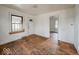 Living room featuring hardwood floors, natural light from a window and white walls at 3049 Foltz St, Indianapolis, IN 46241