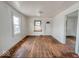 Bright living room with hardwood floors, a window, and a white front door at 3049 Foltz St, Indianapolis, IN 46241