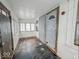 Enclosed front porch entrance with windows, offering additional space and natural light at 3049 Foltz St, Indianapolis, IN 46241