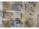 Aerial view of property showcasing the roof, yard, and driveway with car parked at 3829 N Temple Ave, Indianapolis, IN 46205