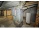 Unfinished basement featuring a metal HVAC duct system and a hot water tank at 3829 N Temple Ave, Indianapolis, IN 46205