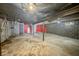 Unfinished basement with exposed piping and concrete flooring at 3829 N Temple Ave, Indianapolis, IN 46205