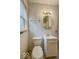 Bathroom with an octagonal mirror, lighting, and fixtures at 3829 N Temple Ave, Indianapolis, IN 46205